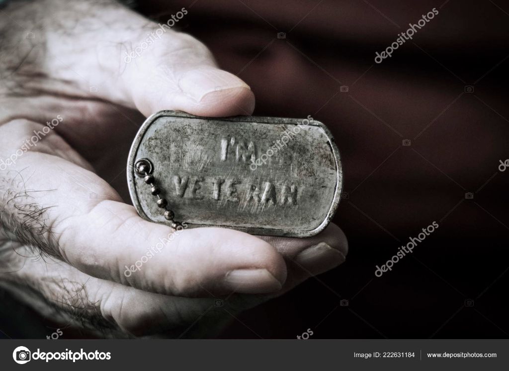a close up photo of engraved dog tags