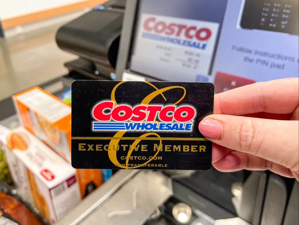 a costco membership card being scanned at checkout.