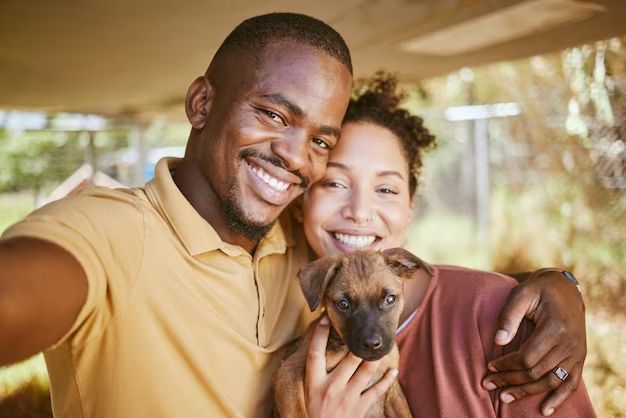 a happy family posing after adopting a dog from an animal shelter