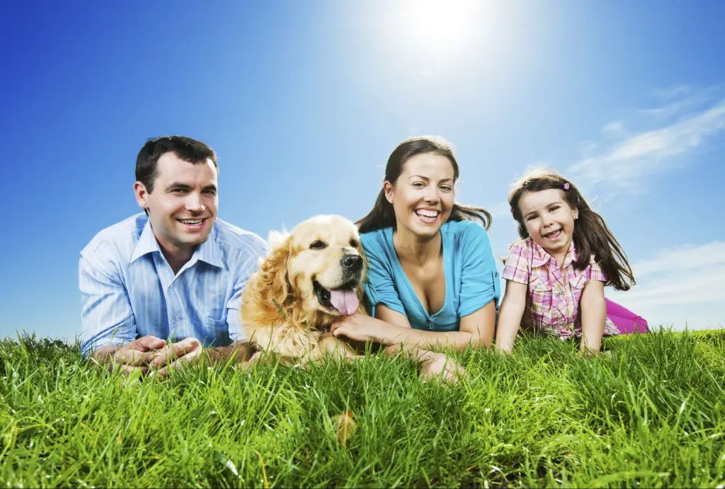 a happy family with their dog