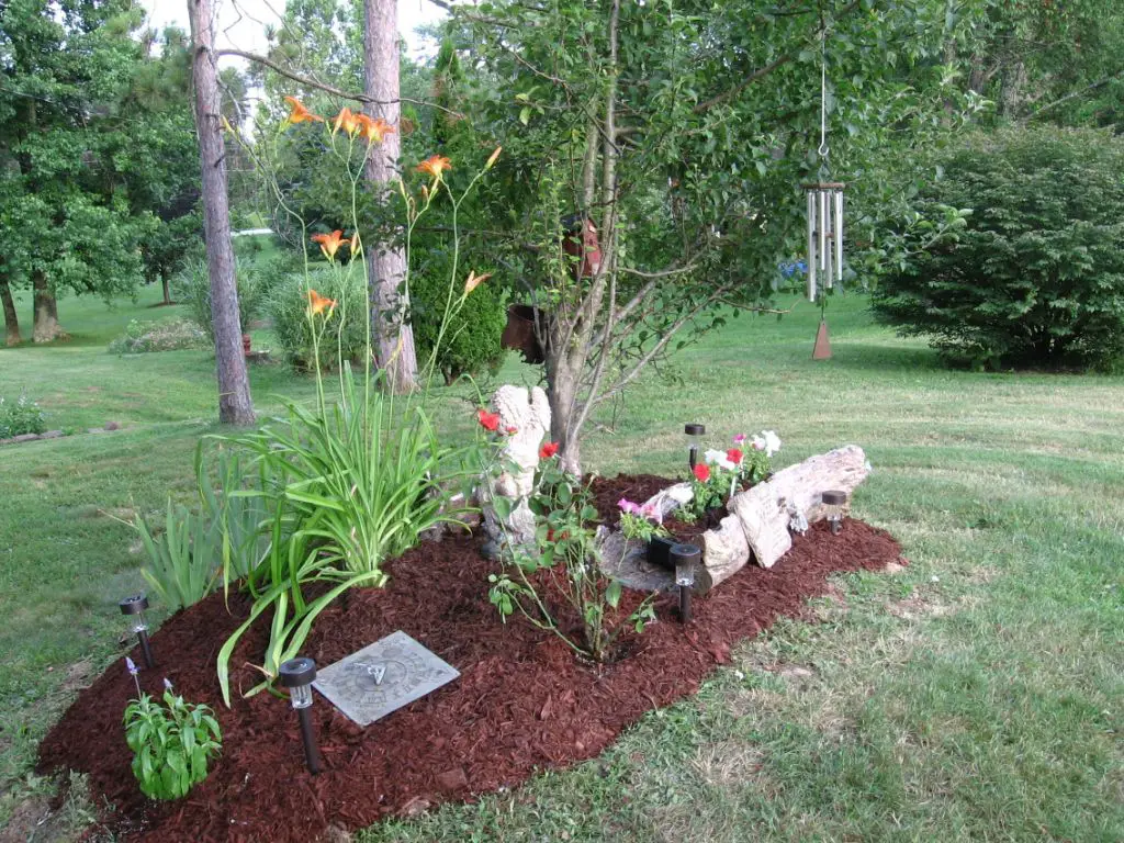 a makeshift pet grave with flowers