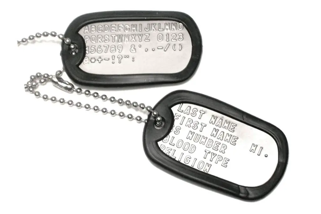 a pair of modern stainless steel military dog tags on a chain.