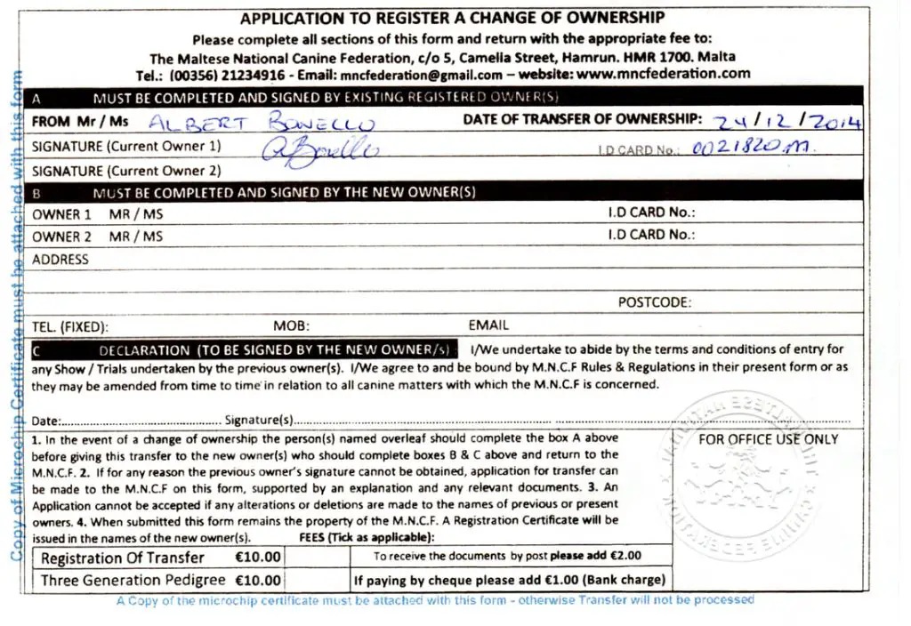 a person filling out a microchip transfer form