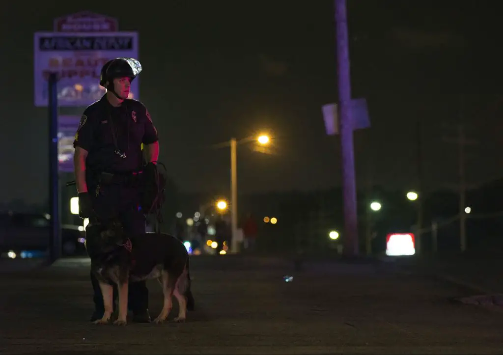 a police officer standing guard at a crime scene