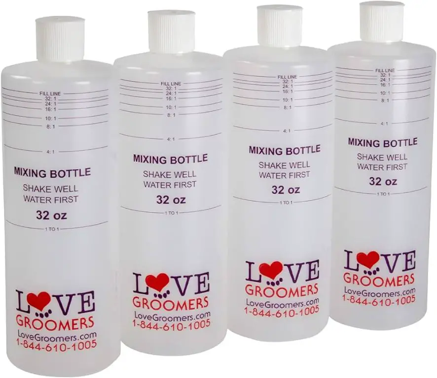 a row of professional dog shampoo bottles on a grooming table