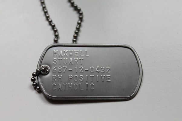 a soldier receiving dog tags during initial entry training.