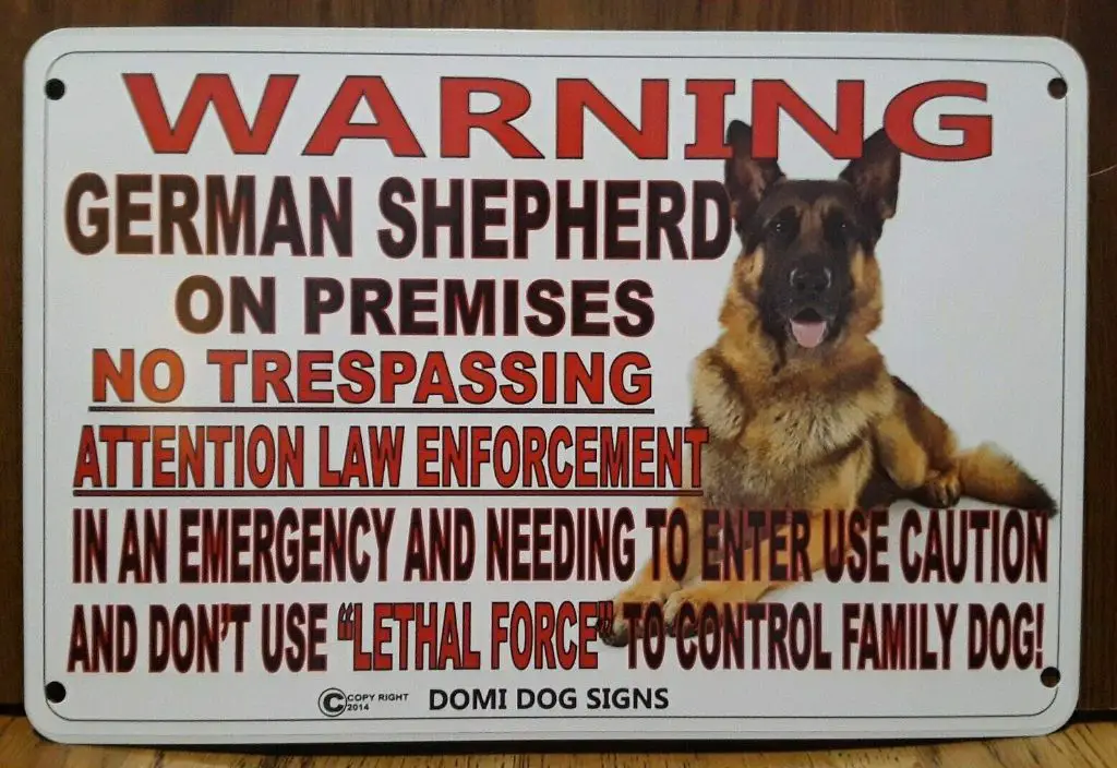 a stately german shepherd dog stands alert, ready to defend its family and property from any potential threats.