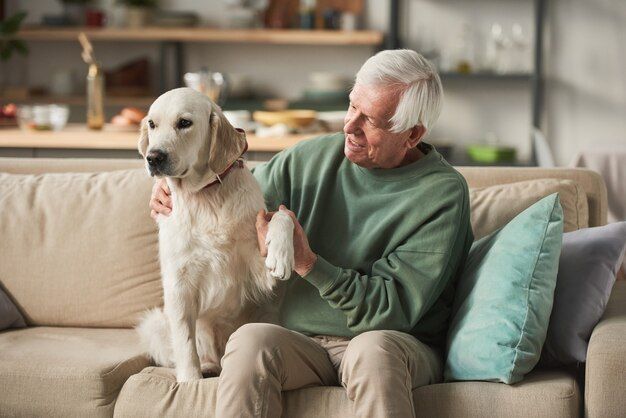 an old dog and person sitting together