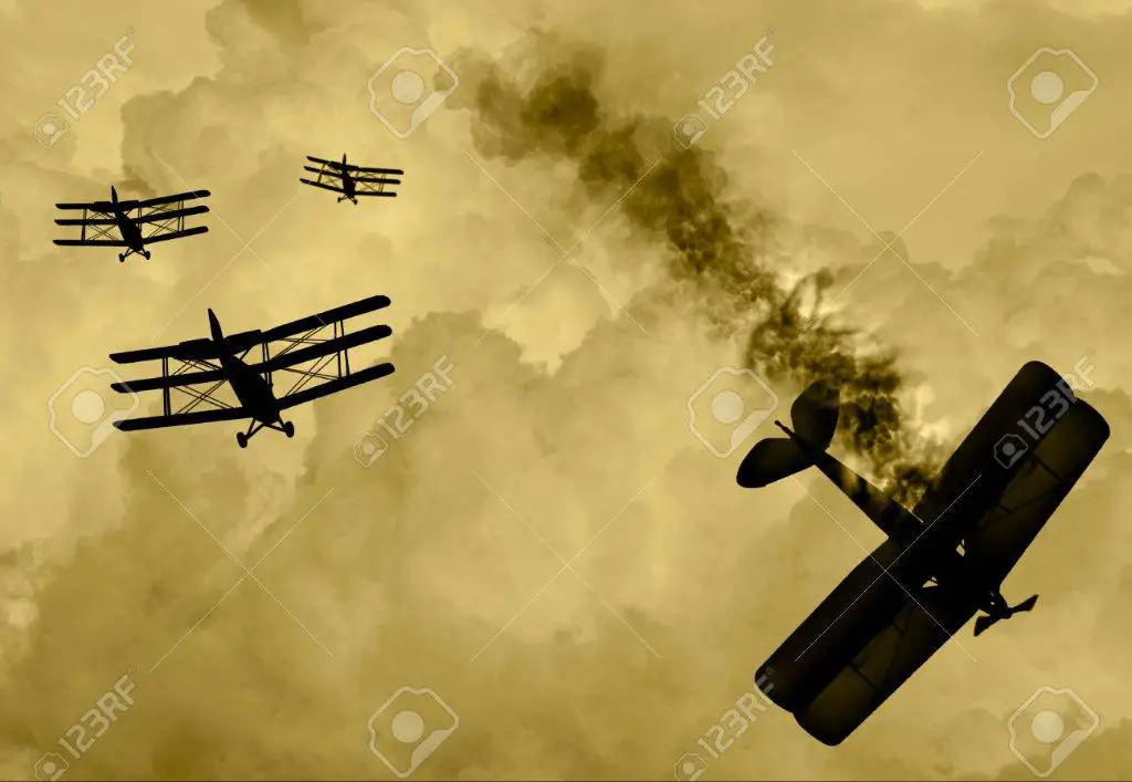 an old photo of planes engaged in a dogfight