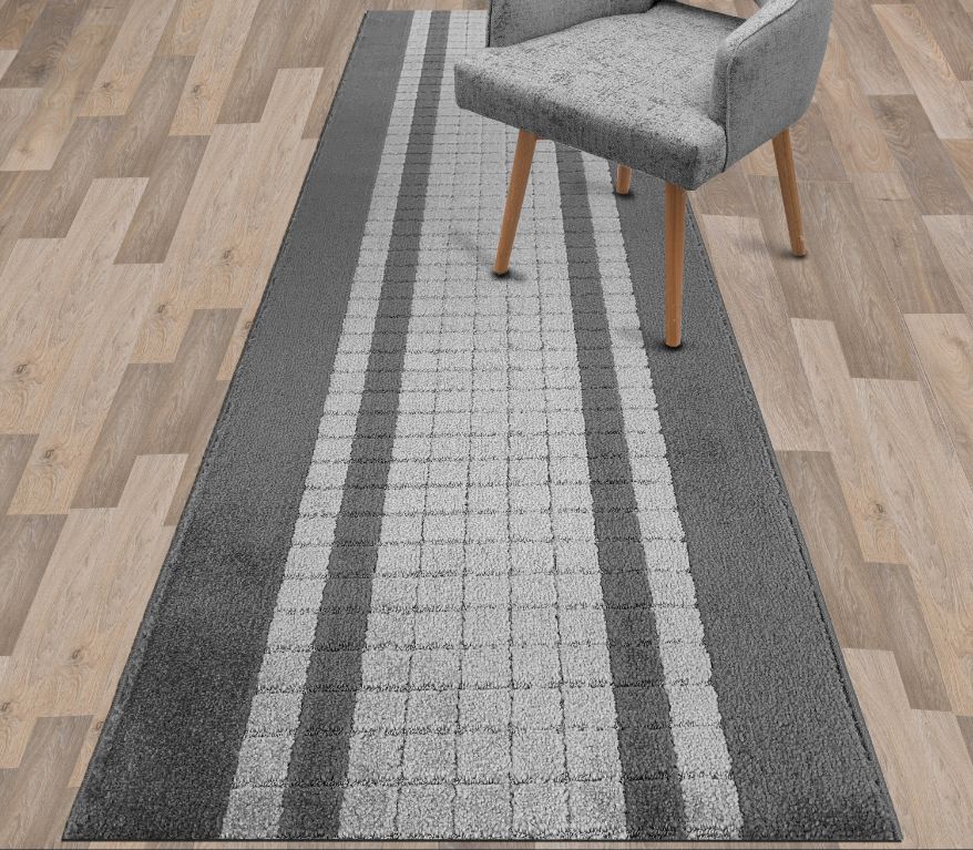 anti-slip rug runners laid down vinyl plank flooring in a hallway.