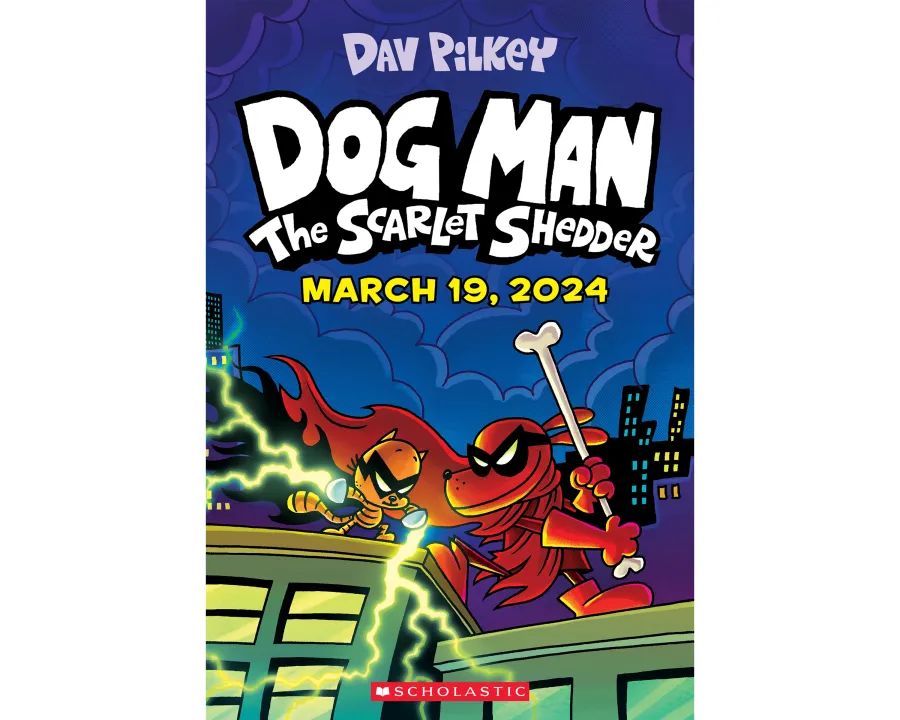 author dav pilkey smiling and holding a dog man book