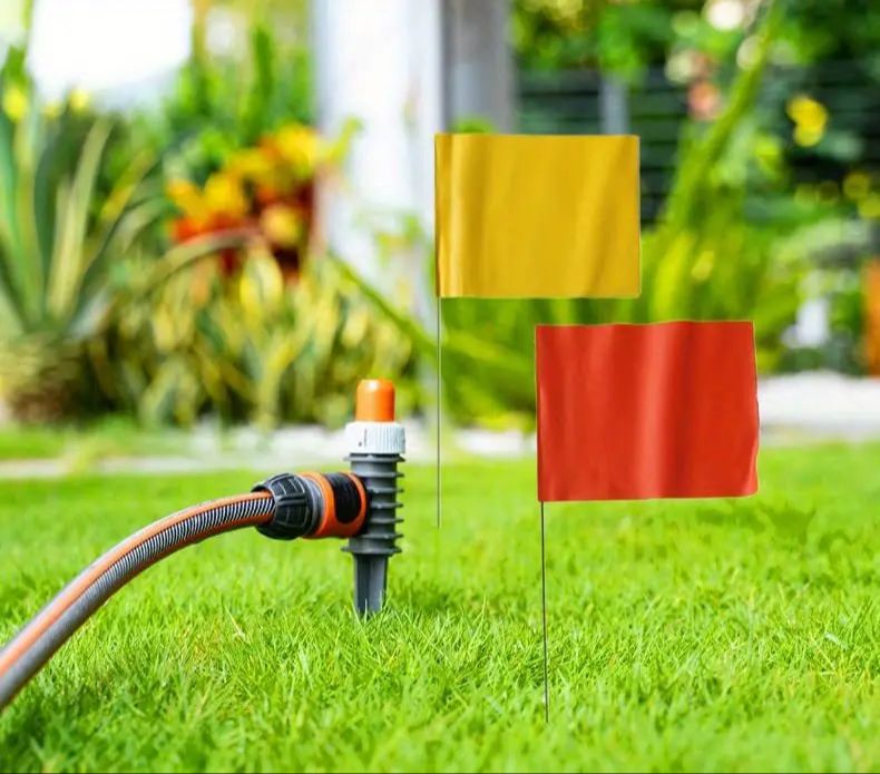 boundary flags marking above-ground electric fence