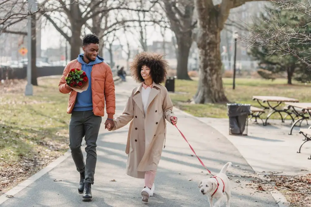 couple walking together holding hands