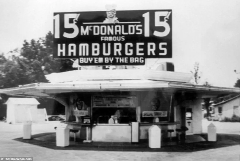 customers inside an early mcdonald's restaurant in the 1950s.