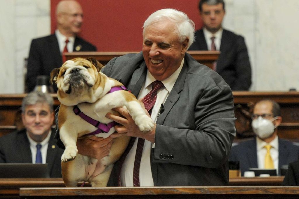 governor justice holding babydog and confirming she's a girl