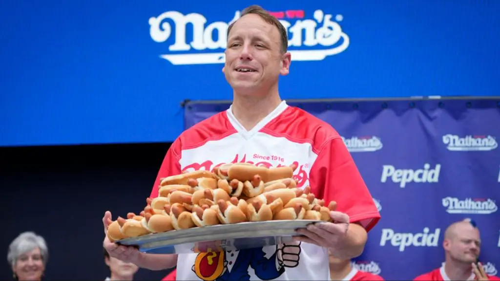 joey chestnut stretching his stomach by drinking large amounts of water before a contest.