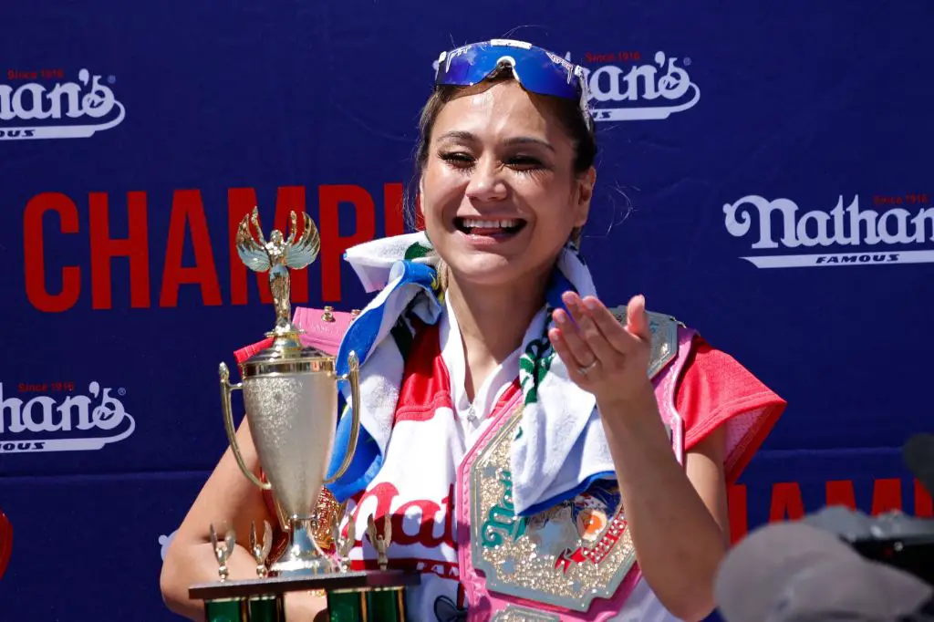 miki sudo holding trophy after winning contest