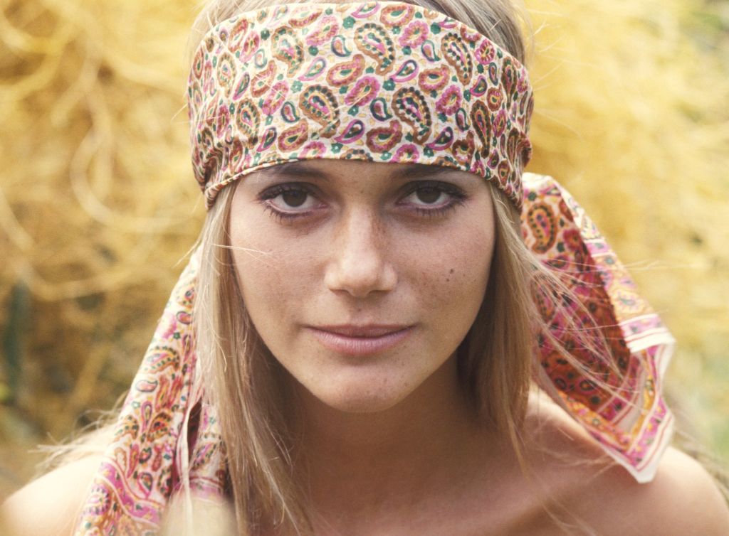 peggy lipton smiling on the red carpet at an event in her later years.