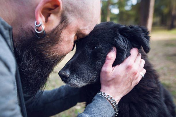 person crying with photo of dog