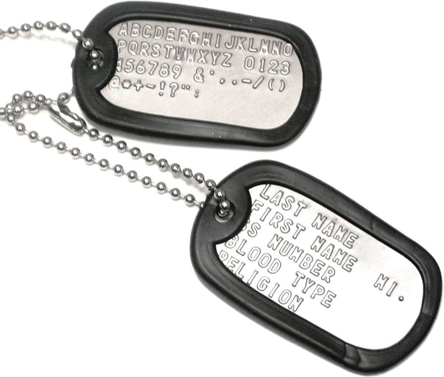 soldier engraving personal information on dog tag