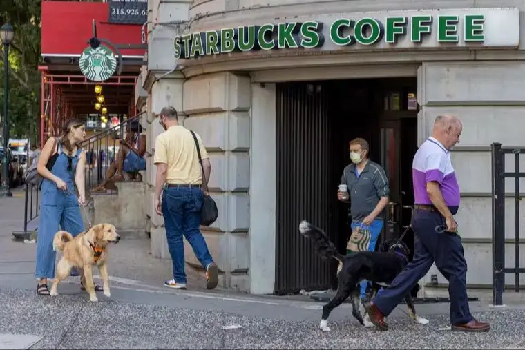 starbucks storefront welcoming people and pets