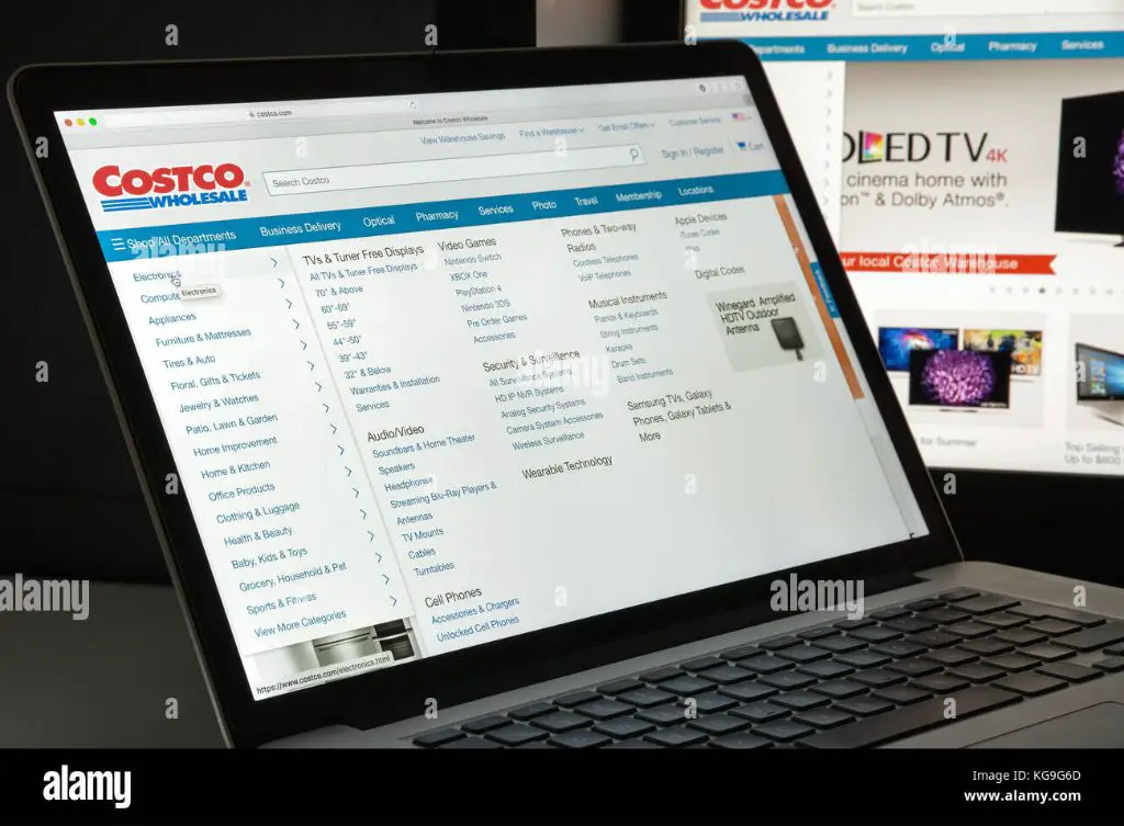 the costco website homepage pictured on a laptop screen.