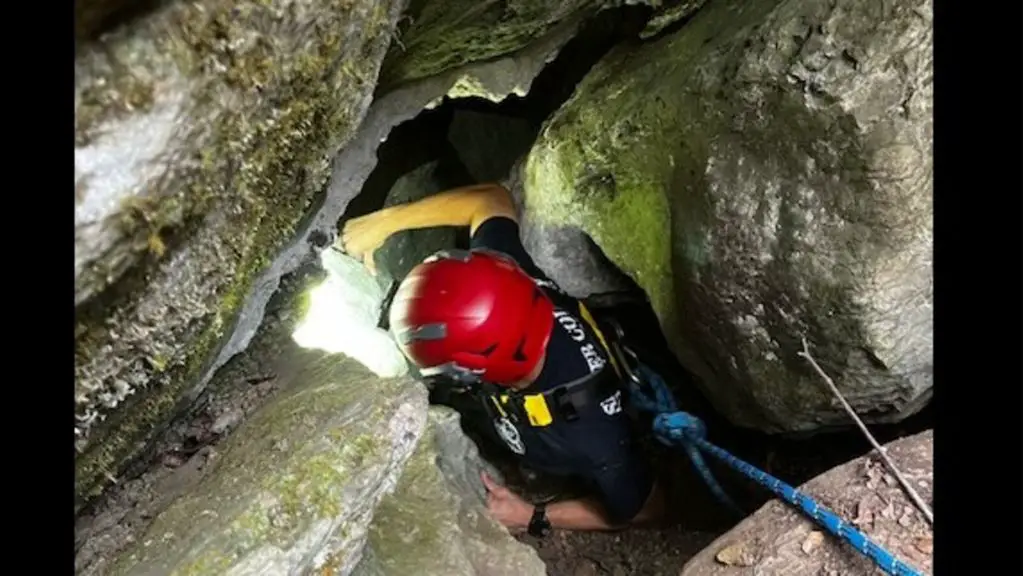 the player inspecting a barricade in a cave